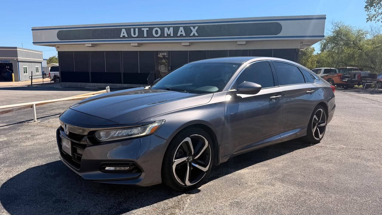 A Honda Accord in front of the Automax office.
